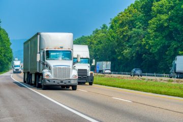 Trucks on the highway covered with inland-marine-insurance